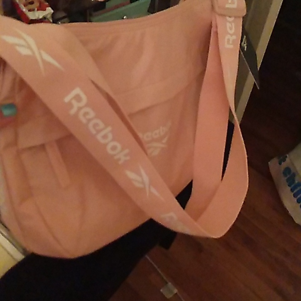 NWT Reebok Women’s Sophie Crossbody/Shoulder Bag with zipper front pocket.